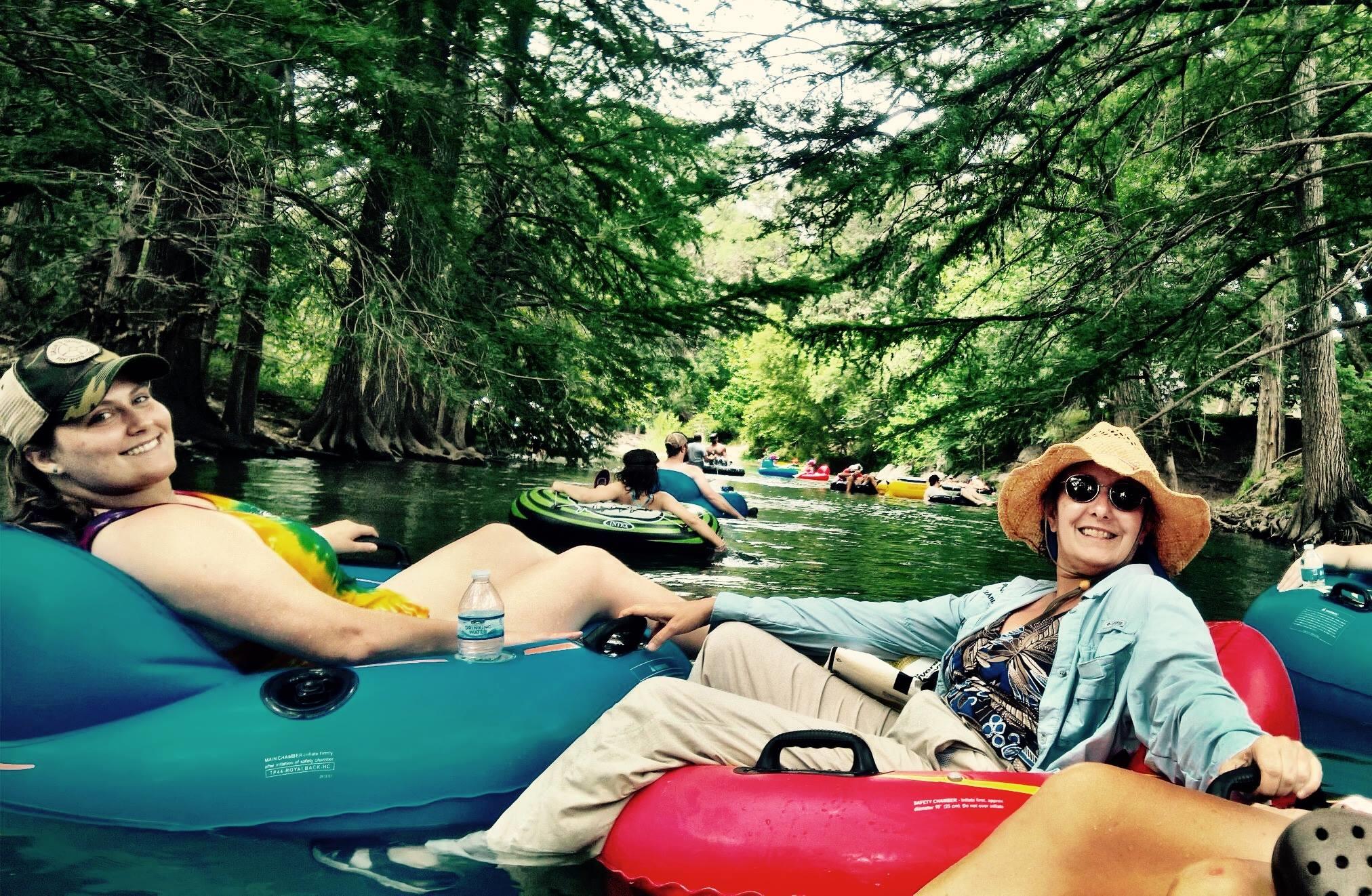 people floating on the river